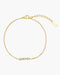 Gold bracelet with three small stones on a white background