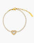 Gold bracelet with a heart-shaped charm on a white background