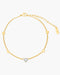 Gold anklet with a heart-shaped diamond on a white background