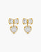 Gold bow-shaped earrings with heart details on a white background