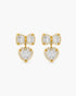 Gold bow-shaped earrings with heart details on a white background