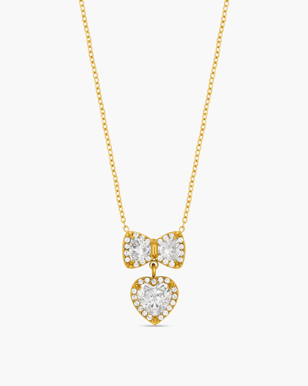 Gold necklace with heart-shaped pendants on a white background