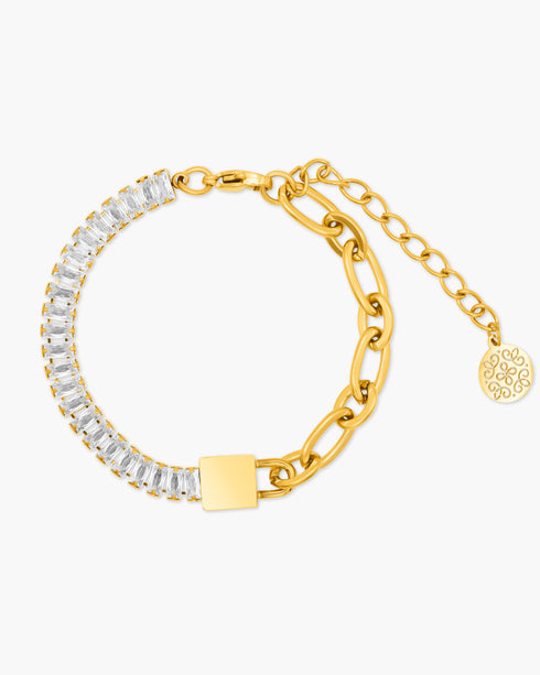 Gold bracelet with clear gemstones on a white background