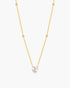Gold necklace with a diamond pendant on a white background