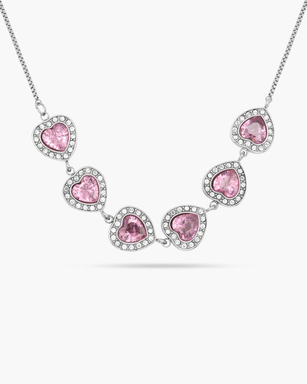 Necklace with pink heart-shaped stones on a white background