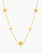 A gold necklace against a white background