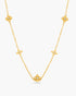 A gold necklace against a white background