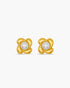 Pair of gold earrings with pearl centers on a white background