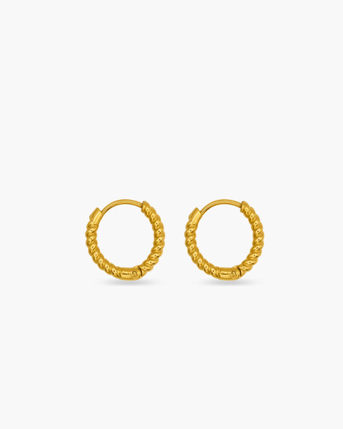Gold hoop earrings on a white background