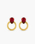 Gold hoop earrings with red gemstones on a white background