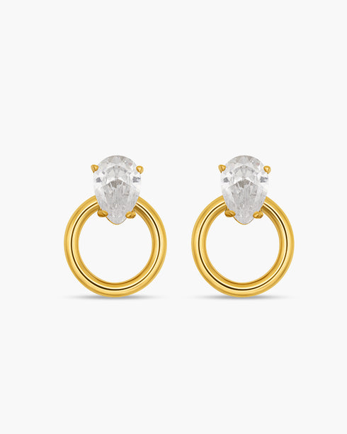 Gold hoop earrings with clear gemstones on a white background