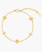 Gold bracelet with clover-shaped charms on a white background