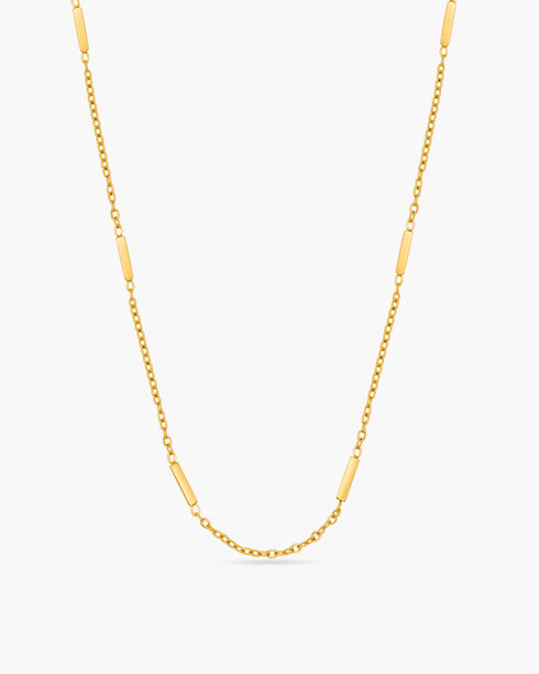 Gold chain necklace on a white background