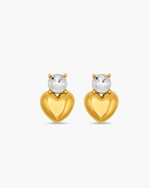 Gold heart-shaped earrings with clear gemstones on a white background