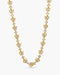Gold necklace with clear stones on a white background