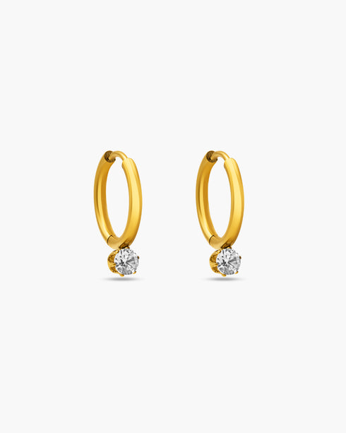 Gold hoop earrings with embedded diamonds on a white background