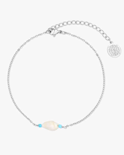 Silver anklet with a pearl and blue stones on a white background