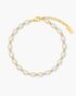 Pearl anklet with gold accents on a white background