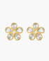 Gold flower-shaped earrings with clear gemstones on a white background