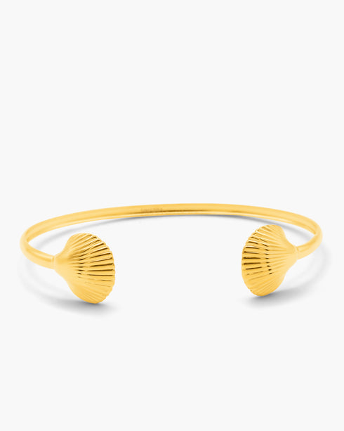 Yellow shell-shaped bangle on a white background