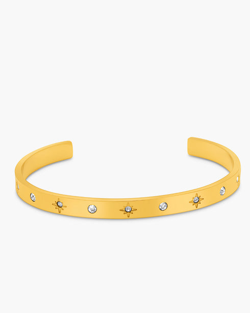 Yellow bracelet with star and gemstone details on a white background