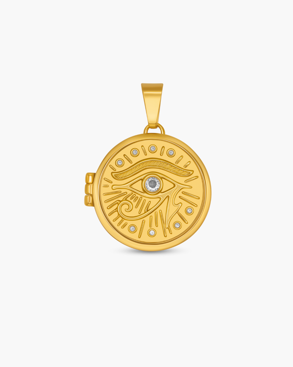 Gold pendant with eye design on a white background