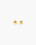 Gold star-shaped earrings on a white background