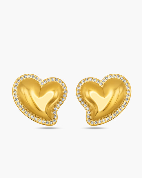 Gold heart-shaped earrings with embedded stones on a white background