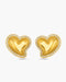 Gold heart-shaped earrings with embedded stones on a white background