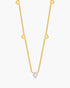 Gold necklace with a diamond pendant on a white background