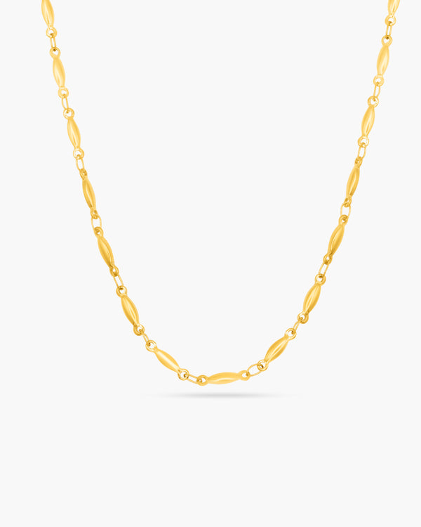 Gold chain necklace on a white background