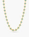 Gold necklace with blue stones on a white background