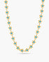 Gold necklace with blue stones on a white background