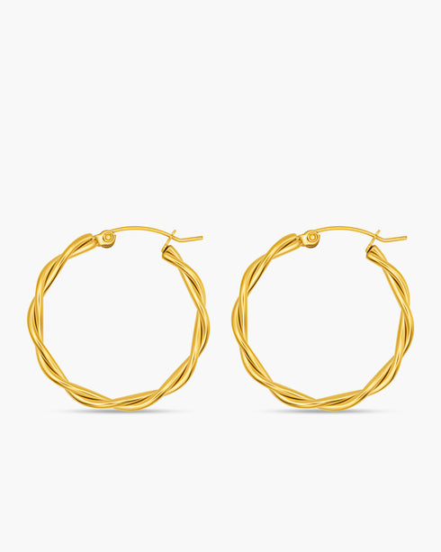 Pair of gold hoop earrings on a white background