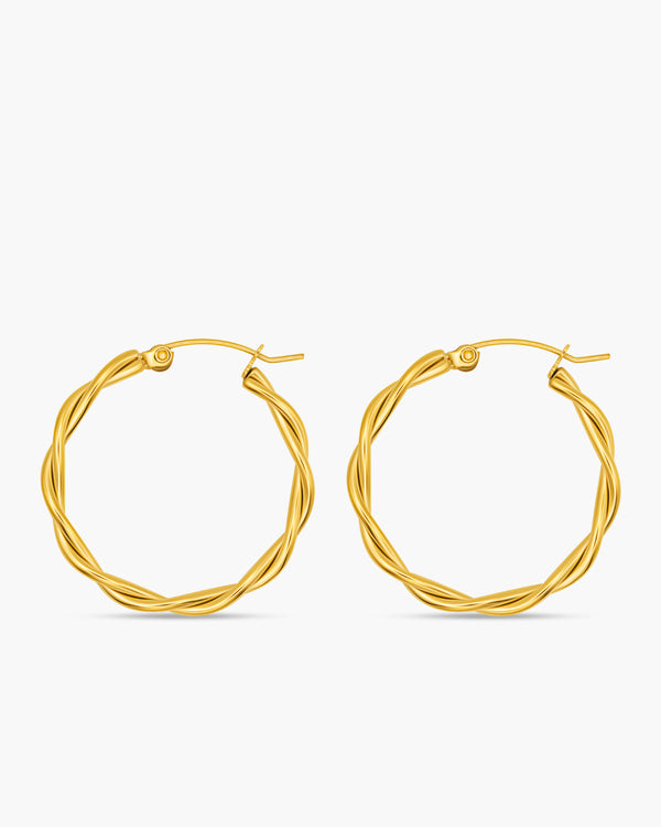 Pair of gold hoop earrings on a white background