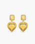 Gold heart-shaped earrings on a white background