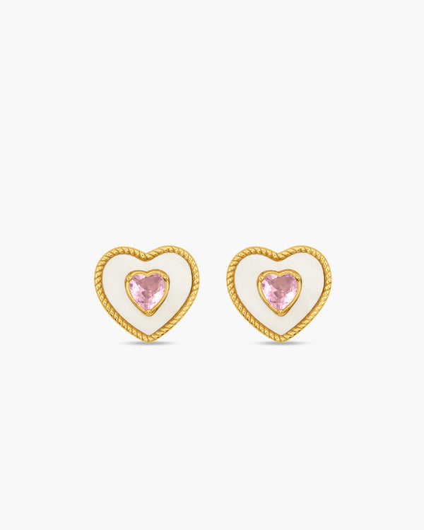 Heart-shaped earrings with pink gemstones on a white background