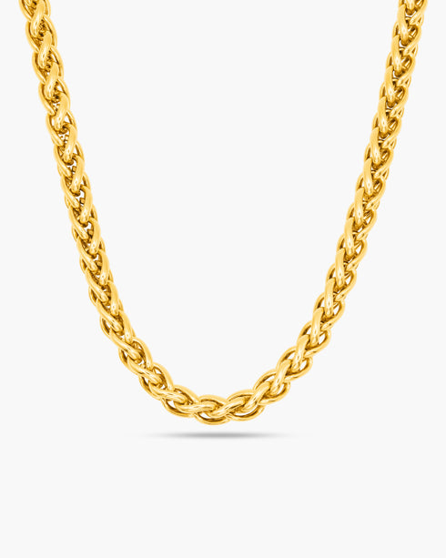 Gold chain necklace on a white background