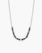 Necklace with black and gray beads on a white background