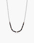 Necklace with black beads on a white background
