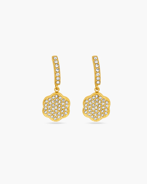 Gold earrings with diamond-like stones on a white background