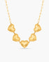 Gold heart-shaped necklace on a white background