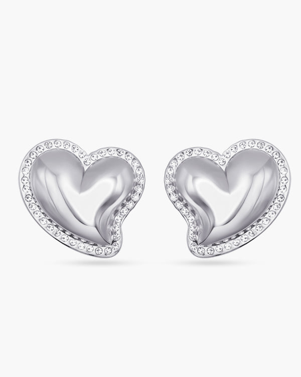 Heart-shaped silver earrings with clear gemstones on a white background