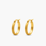 Gold hoop earrings on a white background
