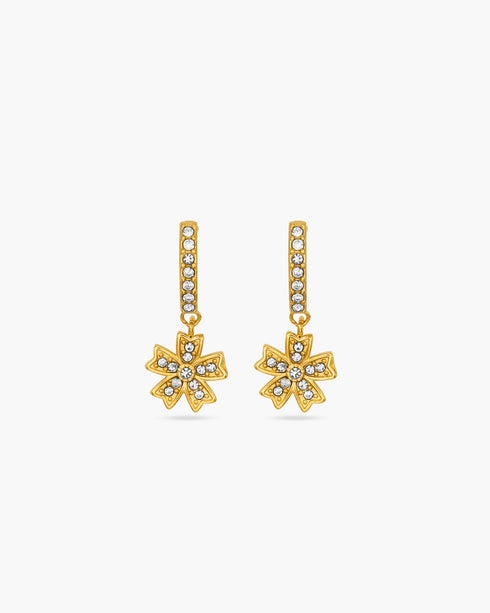 Gold flower-shaped earrings with clear stones on a white background