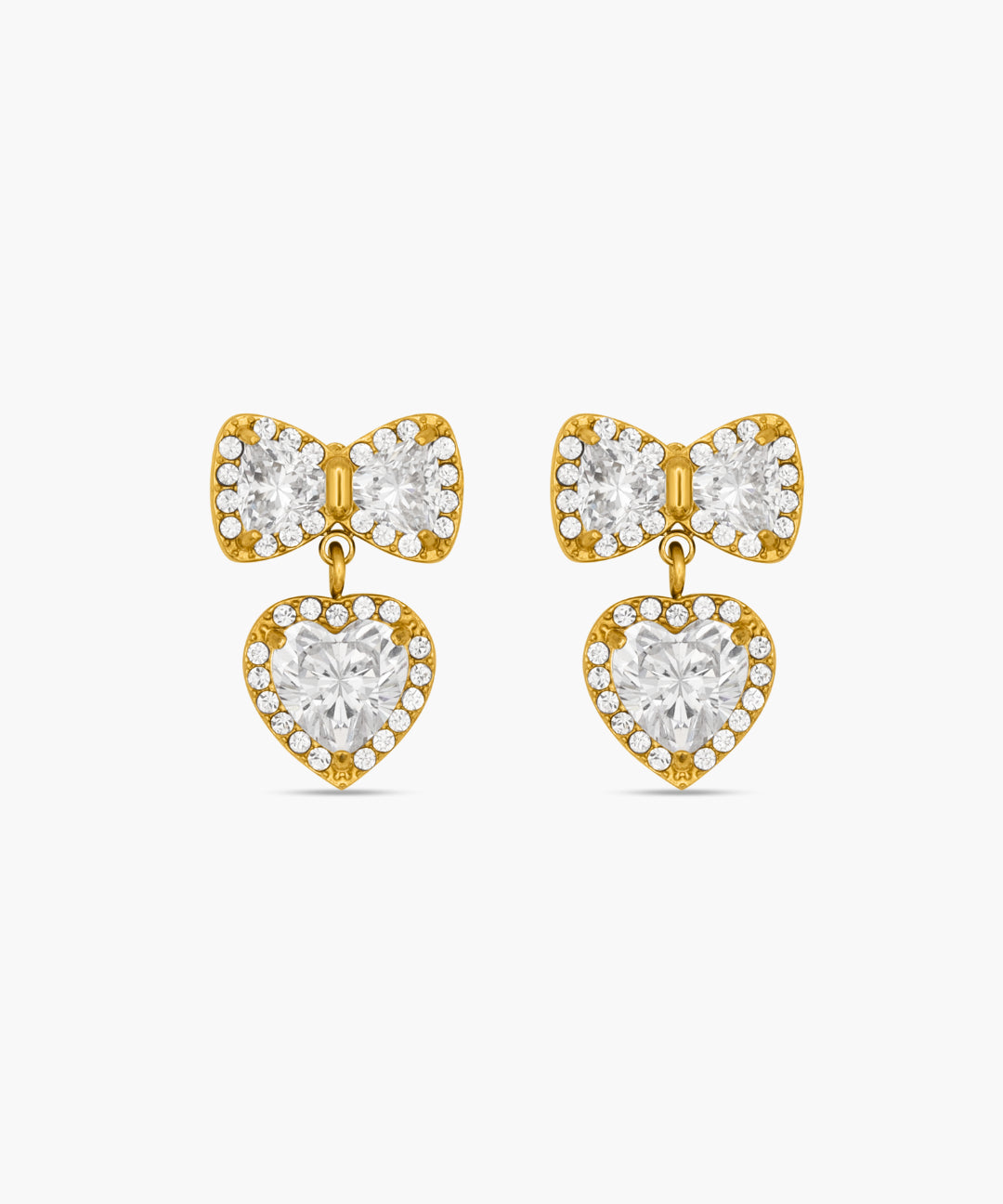 Gold bow-shaped earrings with heart details on a white background
