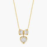 Gold necklace with heart-shaped pendants on a white background