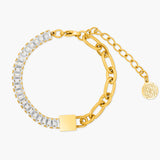 Gold bracelet with clear gemstones on a white background