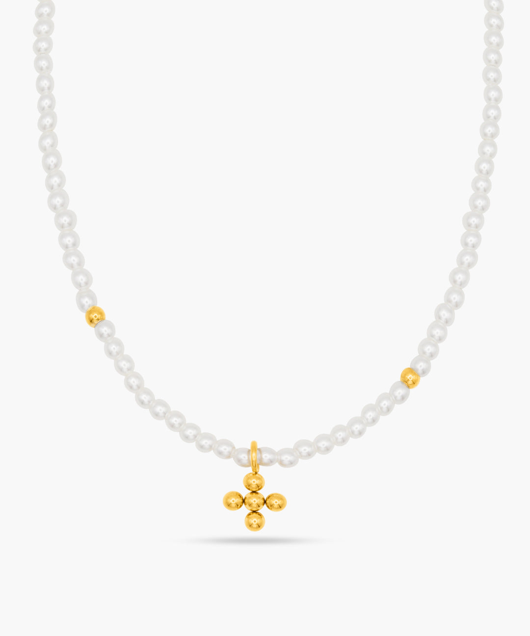 Necklace with white beads and a gold cross pendant on a white background