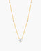 Gold necklace with a diamond pendant on a white background